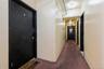 Hall featuring carpet floors
