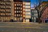 Property at dusk with a view of apartment building / complex