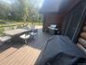 Deck featuring outdoor dining area and grilling area