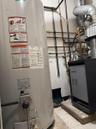 Utility room featuring gas water heater