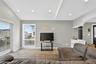 Living room featuring recessed lighting, light wood-type flooring, and arched walkway.