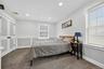 Primary bedroom with carpet