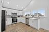 Newly updated kitchen with water view, stainless steel appliances and recessed lighting