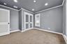 Bedroom with crown molding, carpet floors, and recessed lighting