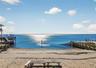 Aerial view of water and beach from home
