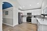 Kitchen with view of hallway