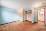 Unfurnished bedroom with a closet and carpet flooring