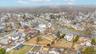 Aerial overview of property's location featuring nearby suburban area