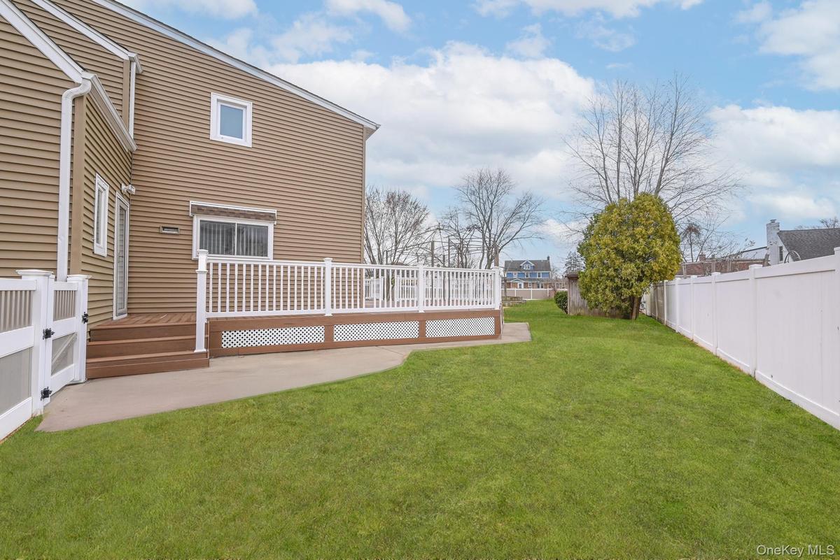 View of yard with a deck