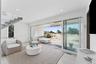 Living area with visible vents and recessed lighting