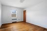 Unfurnished room with radiator and light wood finished floors