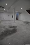 Garage featuring recessed lighting and baseboards