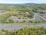 Drone / aerial view with a wooded view