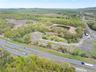 Birds eye view of property featuring a view of trees