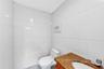 Bathroom with tile walls and vanity