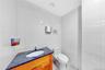 Bathroom with tile walls and vanity