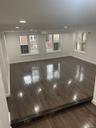 Living room featuring dark wood-style flooring