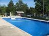 Community pool featuring an outbuilding