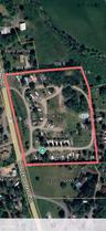 Aerial overview of property's location featuring property parcel outlined
