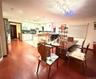 Dining area with light wood finished floors and ornamental molding