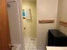 Full bathroom featuring light tile patterned floors, vanity, and shower / washtub combination