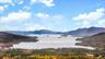 View of mountain backdrop featuring a large body of water