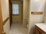 Full bathroom featuring light tile patterned floors, vanity, and shower / bathtub combination