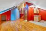 Bonus room featuring vaulted ceiling, light wood-type flooring, stairway, and a skylight