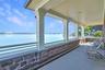 Covered porch with view of Mario Cuomo Bridge