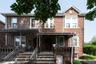 Traditional-style home with brick siding