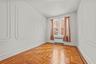 Empty room with radiator and baseboards
