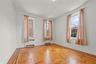 Empty room with radiator heating unit and baseboards