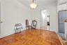 Living area with arched walkways and baseboards