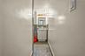 Hall featuring granite floors and baseboards