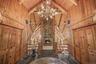 Entrance with stone woodburning fireplace, cathedral ceilings and closets set the stage for the home. You are in for something very special!