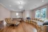 Office space in Primary Suite featuring recessed lighting, wood finished floors, Barn Door Closing, plenty of natural light, a chandelier, and ornamen