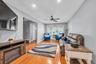 Living area with light wood-type flooring, recessed lighting, and ceiling fan