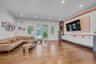 Family room featuring Built in Entertainment Center, ornamental molding, light wood finished floors, and recessed lighting