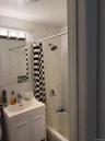 Bathroom featuring vanity and shower / bath combo with shower curtain