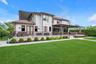 Back of house featuring stucco siding