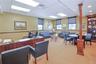 Executive office featuring plenty of natural light and a drop ceiling