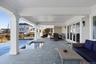 View of patio / terrace with an outdoor hangout area and a pool with connected hot tub
