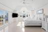 Bedroom with access to exterior, ceiling fan, french doors, and lofted ceiling
