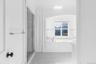 Full bathroom with a garden tub, a shower stall, and vanity