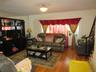 Living room featuring hardwood / wood-style floors and stairway