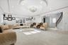 Living area with a tray ceiling, recessed lighting, carpet, stairway, and a chandelier