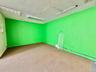 Carpeted empty room with a baseboard heating unit