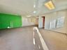 Carpeted empty room with a baseboard radiator and baseboards