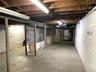 Unfinished basement with water heater and heating unit