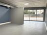 Spare room featuring an ornate ceiling and finished concrete floors